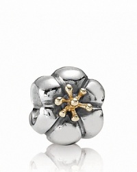 A voluminous bloom in sterling silver with 14K gold stamen. Charm by PANDORA.