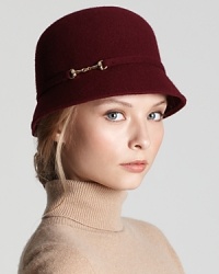 An equestrian-inspired gold buckle lends on-trend sophistication to this classic cloche from Aqua. An equestrian-inspired gold buckle lends on-trend sophistication to this classic cloche from Aqua.