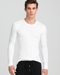 Cut slim for a body-contouring fit, this long sleeve tee shows off your build in soft, breathable cotton for comfort. Cut slim for a body-contouring fit, this long sleeve tee shows off your build in soft, breathable cotton for comfort.