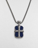 An original design pairs two sterling silver pendants on a single strand. The cross pendant is crafted with pavé diamond detail, and the larger features smooth lapis inlay. Sterling silver Pavé diamonds Lapis Pendant: 1 long Necklace: 24 long Lobster clasp closure Imported 