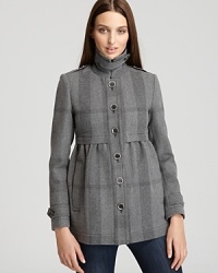 A girlish silhouette feels supremely sophisticated in a check printed pattern. A gathered empire waist finishes the style with a look both youthful and refined. From Burberry Brit. A girlish silhouette feels supremely sophisticated in a check printed pattern. A gathered empire waist finishes the style with a look both youthful and refined. From Burberry Brit.
