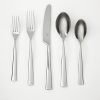 Quality flatware assortment with a streamlined silhouette and attractive flared handle adds a crisp and current touch to any table! Features hi-shine mirror finish in a 45 piece assortment from Robert Welch (set includes service for 8 and 5 serving pieces).