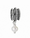 This beveled sterling silver charm features a dangling white pearl, adding instant movement and timeless elegance to your PANDORA bracelet.