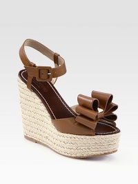 Luscious leather with an adjustable ankle strap, ultra-chunky espadrille wedge and a signature bow adornment. Stacked rope wedge, 5 (125mm)Stacked rope platform, 1 (25mm)Compares to a 4 heel (100mm)Leather upperLeather liningRubber solePadded insoleMade in Italy Luscious leather with an adjustable ankle strap, ultra-chunky espadrille wedge and a signature bow adornment. Stacked rope wedge, 5 (125mm)Stacked rope platform, 1 (25mm)Compares to a 4 heel (100mm)Leather upperLeather liningRubber solePadded insoleMade in Italy