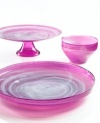 Adding a fun shock of color to modern settings, the small Sweet Plum bowl from Sea Glasbruk pairs luminous violet with swirls of white in handcrafted glass.