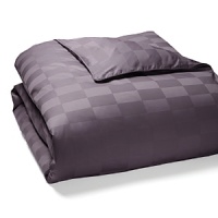 A classic check pattern in cotton jacquard infuses this luxe duvet cover with textural richness. A classic check pattern in cotton jacquard infuses this luxe duvet cover with textural richness.