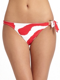 THE LOOKTextured tie-dye patternSide tie closure with golden ring detailElastic waist and leg openingsTHE MATERIAL80% nylon/20% spandexFully linedCARE & ORIGINHand washMade in USAPlease note: Bikini top sold separately. THE LOOKTextured tie-dye patternSide tie closure with golden ring detailElastic waist and leg openingsTHE MATERIAL80% nylon/20% spandexFully linedCARE & ORIGINHand washMade in USAPlease note: Bikini top sold separately.