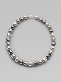 A soft melange of grey, nuage and white baroque man-made pearls creates drama at the neck. 14mm multicolor organic baroque pearls Length, about 20 Sterling silver spring clip clasp Made in Spain