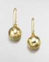Wonderfully simple, wonderfully shimmering spheres of hammered 18k gold. 18k yellow gold Drop, about 1 Diameter, about ½ Ear wire Imported