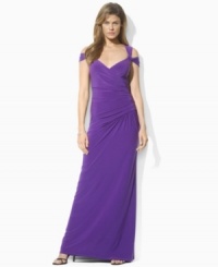 A sweeping floor-length gown from Lauren by Ralph Lauren is rendered in slinky matte jersey with elegantly draped sleeves and a crossover neckline for an alluring evening ensemble. A sweeping floor-length gown from Lauren by Ralph Lauren is rendered in slinky matte jersey with elegantly draped sleeves and a crossover neckline for an alluring evening ensemble.