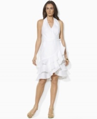 A foundation of airy tissue linen creates breezy style on Lauren by Ralph Lauren's sleeveless wrap dress, tailored with a chic V-neckline and ruffled cutaway hem for an ultra-feminine look. A foundation of airy tissue linen creates breezy style on Lauren by Ralph Lauren's sleeveless wrap dress, tailored with a chic V-neckline and ruffled cutaway hem for an ultra-feminine look.