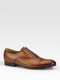Cap-toe leather shoe with embossed gucci script logo. Leather sole Made in Italy Please note: For best fit, please size down one full size. Cap-toe leather shoe with embossed gucci script logo. Leather sole Made in Italy Please note: For best fit, please size down one full size.