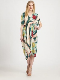 A colorful graphic print swirls around smooth fabric, with dramatically draped skirt for a fluid-effect. V-neckGathered shouldersOver-sized short dolman sleevesSelf-tie waistAsymmetrical hemAbout 49 from natural waistPolyesterDry cleanMade in USA of Italian fabricModel shown is 5'10 (177cm) wearing US size Small. A colorful graphic print swirls around smooth fabric, with dramatically draped skirt for a fluid-effect. V-neckGathered shouldersOver-sized short dolman sleevesSelf-tie waistAsymmetrical hemAbout 49 from natural waistPolyesterDry cleanMade in USA of Italian fabricModel shown is 5'10 (177cm) wearing US size Small.
