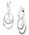 Drop everything for these chic hoops from Jones New York! Multiple ovals and a ball pendant make a unique statement. Crafted from worn silver tone mixed metal. Clip-on backing for non-pierced ears. Approximate drop: 1 inch.