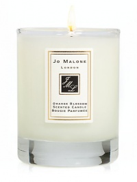 Add the finishing touch to your home by decorating interiors with the refreshingly delicious scent of Orange Blossom. This 2.1 oz. scented travel candle will help create the perfect ambience in any room. Burn time approx. 15 hrs.