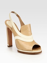 Island platform, snake-print leather trim and a stretchy slingback renew this smooth leather basic. Self-covered heel, 5 (125mm)Island platform, ½ (15mm)Compares to a 4½ heel (115mm)Leather and snake-print leather upperLeather lining and solePadded insoleMade in ItalyOUR FIT MODEL RECOMMENDS ordering one size up as this style runs small. Island platform, snake-print leather trim and a stretchy slingback renew this smooth leather basic. Self-covered heel, 5 (125mm)Island platform, ½ (15mm)Compares to a 4½ heel (115mm)Leather and snake-print leather upperLeather lining and solePadded insoleMade in ItalyOUR FIT MODEL RECOMMENDS ordering one size up as this style runs small.
