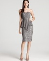 Sophisticated and subtle, this Badgley Mischka dress boasts delicate beading, played down by a sheer mesh overlay.