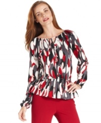 Ellen Tracy's peasant top features a big bold print that instantly wakes up casual days. Ellen Tracy's peasant top features a big bold print that instantly wakes up casual days.