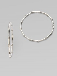 From the Nusa Penida Collection. Simple bamboo-textured hoops crafted in fine sterling silver are a design expressly created to support an afforestation project on Nusa Penida, an arid island off the coast of Bali. John Hardy will donate a portion of each purchase to the cost of planting bamboo. This earring will support the planting of 9 bamboos, which is inscribed inside the earring. Sterling silver Diameter, about 2 Pierced Made in Bali From the Nusa Penida Collection. Simple bamboo-textured hoops crafted in fine sterling silver are a design expressly created to support an afforestation project on Nusa Penida, an arid island off the coast of Bali. John Hardy will donate a portion of each purchase to the cost of planting bamboo. This earring will support the planting of 9 bamboos, which is inscribed inside the earring. Sterling silver Diameter, about 2 Pierced Made in Bali
