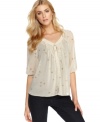 Master ethereal style in this top from Kensie, where a soft, leaf-print blooms over gauzy chiffon!