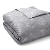Lilac bouquets in shades of slate grey adorn comforters and shams in this floral Calvin Klein Home collection. Lilac bouquets in shades of slate grey adorn comforters and shams in this floral Calvin Klein Home collection.