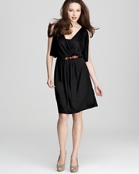 The little black dress gets a warm weather refresher with an airy silhouette featuring breezy sleeves. Pair the DKNY staple with a neon belt for an added punch of color. The little black dress gets a warm weather refresher with an airy silhouette featuring breezy sleeves. Pair the DKNY staple with a neon belt for an added punch of color.