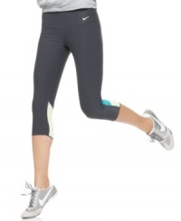 Athletic details like ventilating insets at the knees and a hidden pocket at the waistband give these Nike capris high-performance style. Athletic details like ventilating insets at the knees and a hidden pocket at the waistband give these Nike capris high-performance style.