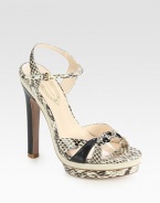 Snake-print leather style an adjustable ankle strap, island platform and a contrasting heel. Self-covered heel, 5½ (140mm)Island platform, 1 (25mm)Compares to a 4½ heel (115mm)Snake-print leather upperLeather lining and solePadded insoleImportedOUR FIT MODEL RECOMMENDS ordering one size up as this style runs small. 