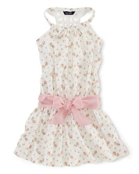 A summer charmer, this floral sleeveless dress finished with a crocheted racerback and a pretty pink sash is the perfect party dress for a June wedding. A summer charmer, this floral sleeveless dress finished with a crocheted racerback and a pretty pink sash is the perfect party dress for a June wedding.