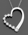 The popular journey design exudes unexpected beauty in this romantic stylized heart setting. This beautiful pendant features round-cut diamonds (1/10 ct. t.w.) set in 14k white gold. Diamond necklace approximate length: 18 inches. Approximate drop: 3/4 inches.
