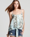 In a pale-hued snake print, this Aqua tank makes a chic entrance with a knotted front hem.