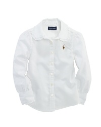 A preppy shirt in crisp cotton oxford is designed with stylish ruffles for a girlie look. A preppy shirt in crisp cotton oxford is designed with stylish ruffles for a girlie look.