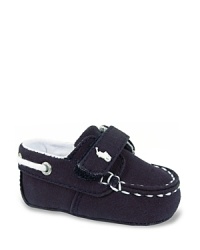 The foundation of his preppy summer look, a classic boat shoe in navy canvas, featuring a single hook closure for easy on-off. The foundation of his preppy summer look, a classic boat shoe in navy canvas, featuring a single hook closure for easy on-off.