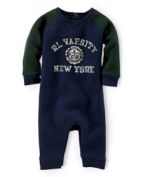 A preppy long-sleeved coverall in soft and durable utility cotton fleece is screen-printed with an athletic varsity design. A preppy long-sleeved coverall in soft and durable utility cotton fleece is screen-printed with an athletic varsity design.