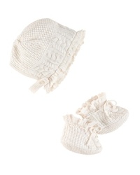 An adorable bonnet-and-bootie set is rendered in soft cable-knit cotton. An adorable bonnet-and-bootie set is rendered in soft cable-knit cotton.