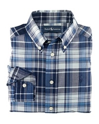 A tried-and-true button-front design is rendered in a vibrant madras plaid. A tried-and-true button-front design is rendered in a vibrant madras plaid.