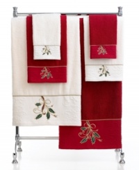 Ring in the holiday season in Lenox style. Featuring soft cotton embellished with festive holly-and-ribbon embroidery and tasteful touches of gold, this hand towel charms your bath with seasonal elegance. Ring in the holiday season in Lenox style. Featuring soft cotton embellished with festive holly-and-ribbon embroidery and tasteful touches of gold, this hand towel charms your bath with seasonal elegance.