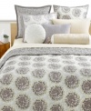 Cozy up to a new look of cool. Style&co.'s Snow Willow quilt boasts a medallion print on one side and a grey abstract print on the other for two great looks in one! Featuring pure cotton. (Clearance)