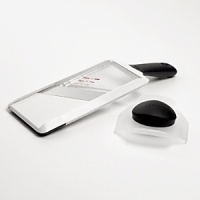 OXO hand held mandoline. The hand-held mandoline slicer puts the versatility of a mandoline in the palm of your hand. Now you can slice perfect, thin fruits and vegetables safely and easily. It features 3 different thicknesses for slicing, has a unique built-in window to show the sliced pieces below, and can be used over a plate or cutting board. It can also hook onto a bowl and the food holder protects your hands and covers the stainless steel blade when not in use. OXO hand held mandoline. The hand-held mandoline slicer puts the versatility of a mandoline in the palm of your hand. Now you can slice perfect, thin fruits and vegetables safely and easily. It features 3 different thicknesses for slicing, has a unique built-in window to show the sliced pieces below, and can be used over a plate or cutting board. It can also hook onto a bowl and the food holder protects your hands and covers the stainless steel blade when not in use.