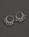 Inspired by Zen philosophy, these hoop earrings from Paul Morelli feature intricately detailed sterling silver meditation bells, set with peridot cabochons.