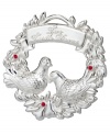 Feather your holiday nest with the Two Turtle Doves ornament from Waterford. A gleaming silver-plated wreath and birds with ruby-red accents make for a merry Christmas tree.