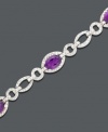 At the office or the opera, oval links and amethyst (4 ct. t.w.) shine with the addition of sparkling diamond accents. Bracelet crafted in sterling silver. Approximate length: 7 inches.