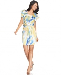 Vince Camuto's latest dress will be a bright spot in your wardrobe with its colorful print and playfully stylish silhouette. Vince Camuto's latest dress will be a bright spot in your wardrobe with its colorful print and playfully stylish silhouette.