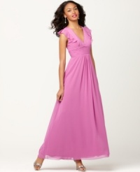 This evening gown by Jessica Simpson is full of extra feminine details, including beautiful ruffled cap sleeves and a pleated empire waistband. Perfect for everything from proms to wedding parties! This evening gown by Jessica Simpson is full of extra feminine details, including beautiful ruffled cap sleeves and a pleated empire waistband. Perfect for everything from proms to wedding parties!