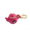Tip it over and the style comes out! This cute pink epoxy teapot charm is embellished with clear stone accents and logo detail. Crafted in gold tone brass. Finished with a lobster clasp closure. Chain not included. Approximate length: 1-3/4 inches.