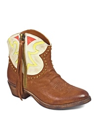 Red, white and so you, these Western booties are long on attitude in a short, colorful silhouette, finished off with swinging tassels and swaggering studs. Red, white and so you, these Western booties are long on attitude in a short, colorful silhouette, finished off with swinging tassels and swaggering studs.