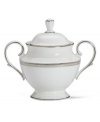 Metropolitan sensibility and modern design combine in this understated white bone china sugar bowl from Lenox's collection of dinnerware and dishes. Platinum gild along the edge is enhanced by a clean, platinum geometric pattern reminiscent of architectural accents.