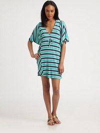Vibrant stripes on stretch jersey, all in an easy cinched-waist shift.V necklineShort sleevesDrawstring waistAbout 15 from natural waist96% rayon/4% spandexDry cleanMade in USAModel shown is 5'9 (175cm) wearing US size Small. Vibrant stripes on stretch jersey, all in an easy cinched-waist shift.V necklineShort sleevesDrawstring waistAbout 15 from natural waist96% rayon/4% spandexDry cleanMade in USAModel shown is 5'9 (175cm) wearing US size Small.