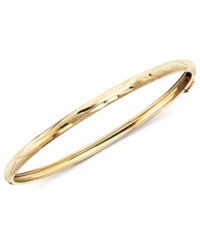 A perfect first bracelet, this small-sized bangle is made of delicately etched 14k gold in a flexible design. A perfect first bracelet, this small-sized bangle is made of delicately etched 14k gold in a flexible design.
