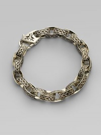 A contemporary spin on a sartorial classic, carved in links of sterling silver with thorn detail. Sterling silver Length, about 9 Diameter, about 3 Lobster clasp closure Imported